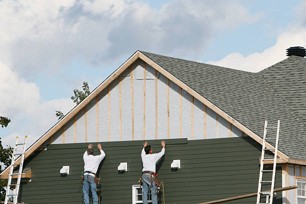 Professional Storm Damage Siding Repair technician working in North Bend, OR